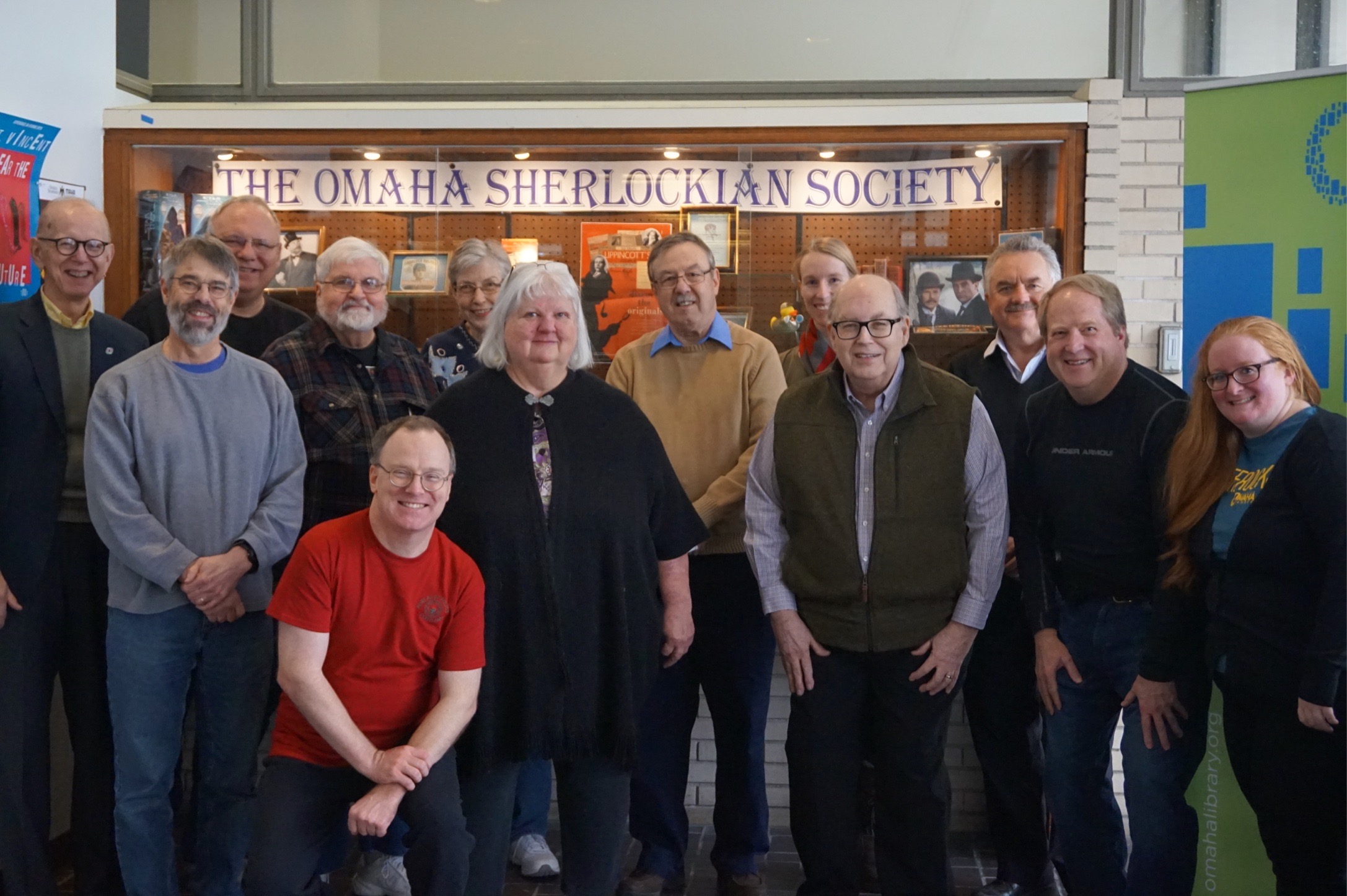 Society members in front of library display